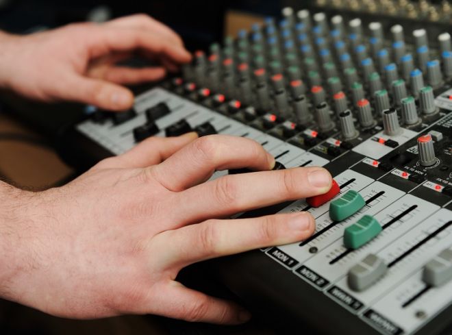 Closeup audio mixer with buttons